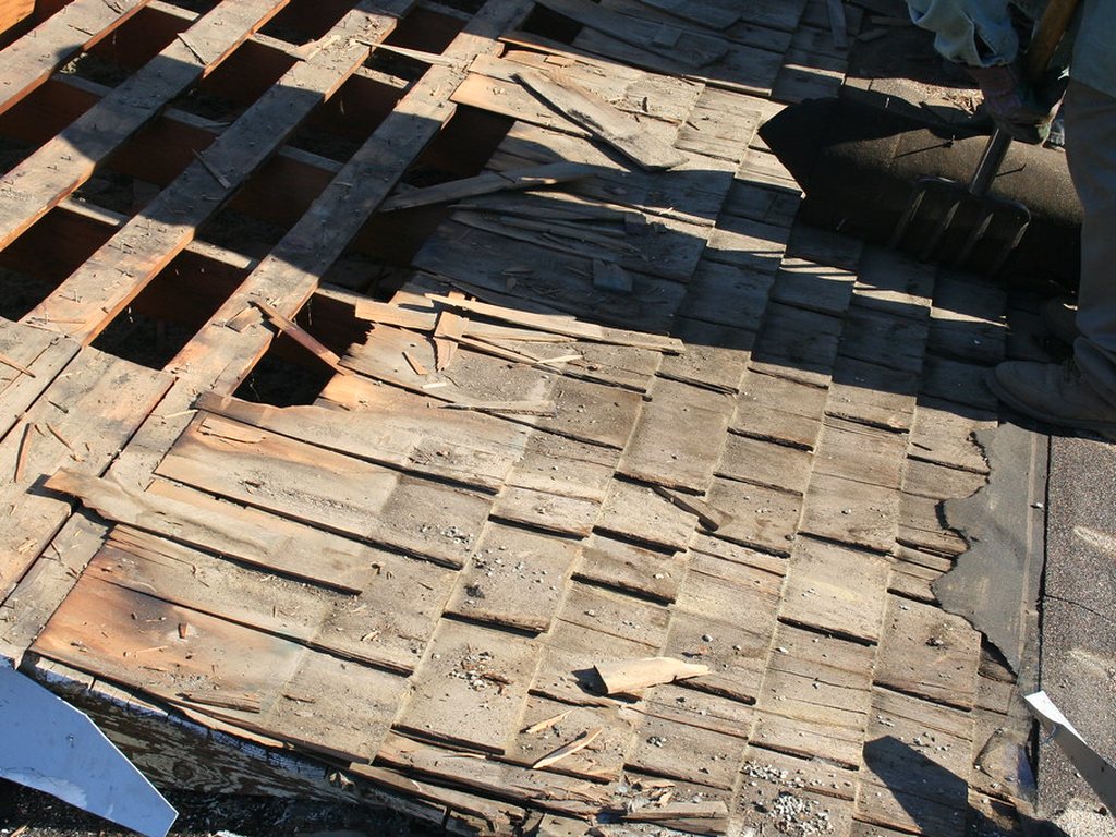 Roof deck exposed during a tear-off and repair of damaged roofing